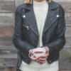 woman wearing classic biker-style leather jacket