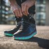 Man doing up his LED high top running shoes
